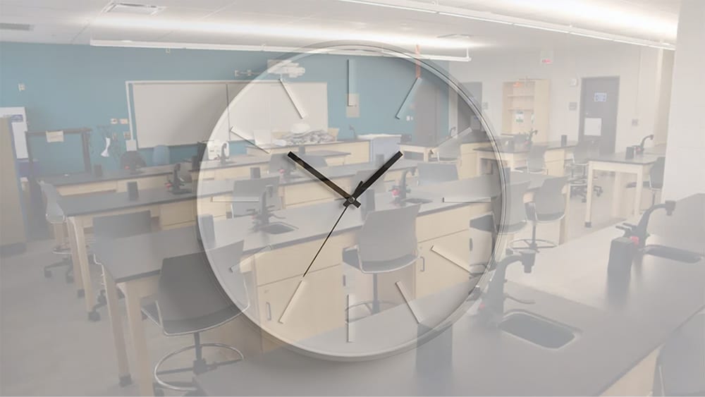 Modern science laboratory superimposed with a clock